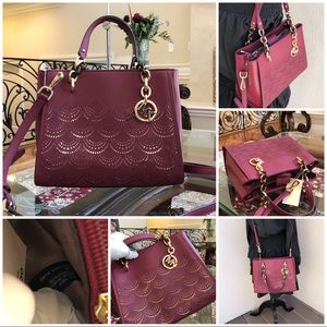 Authentic Michael Kors perforated handbag